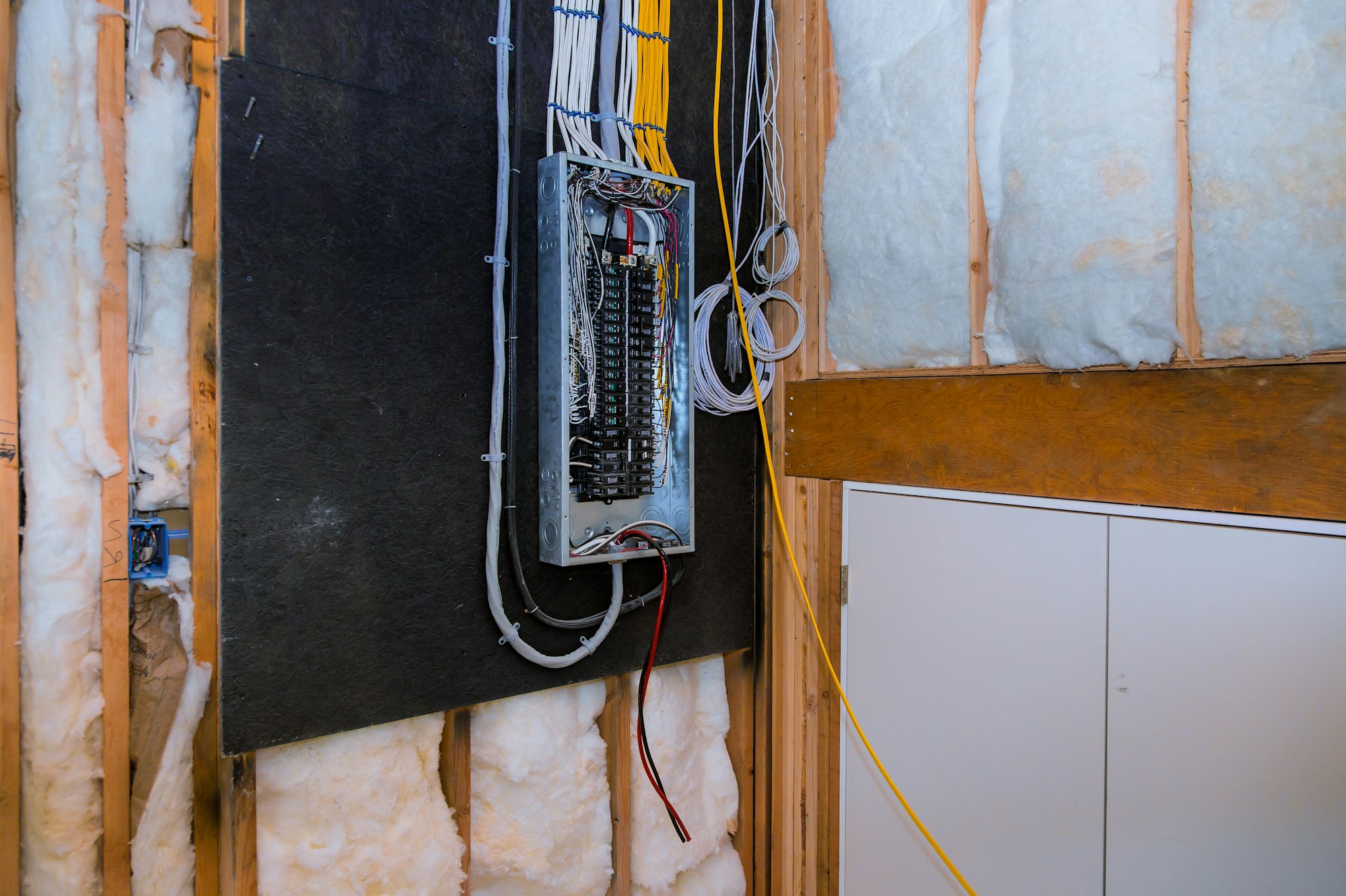 Interior of a new home under construction board connection electric system in cabinet new breakers